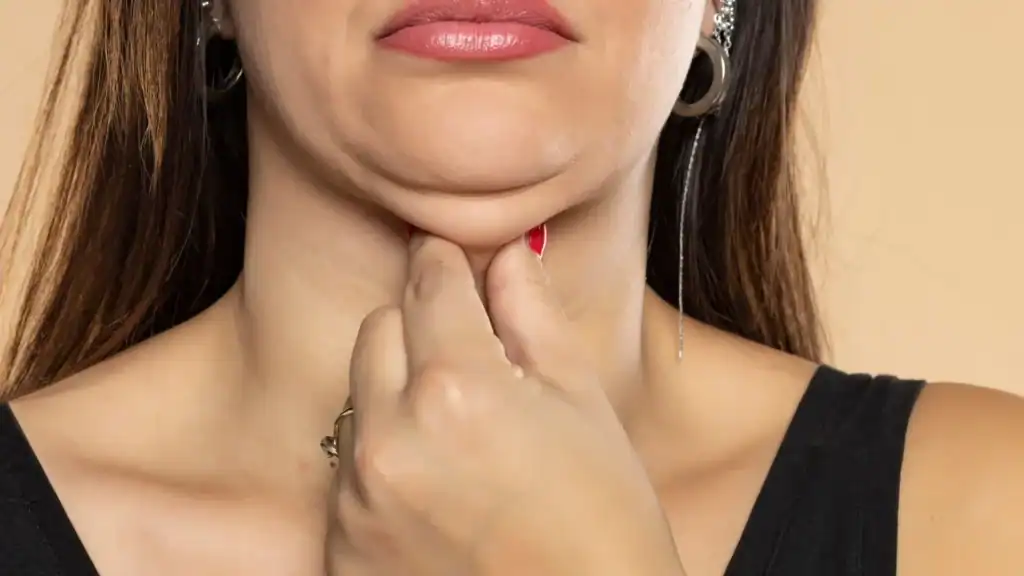 An image of a woman with double chin, sad, worried : Non Surgical Double Chin Removal Treatment in Bromyard, UK
